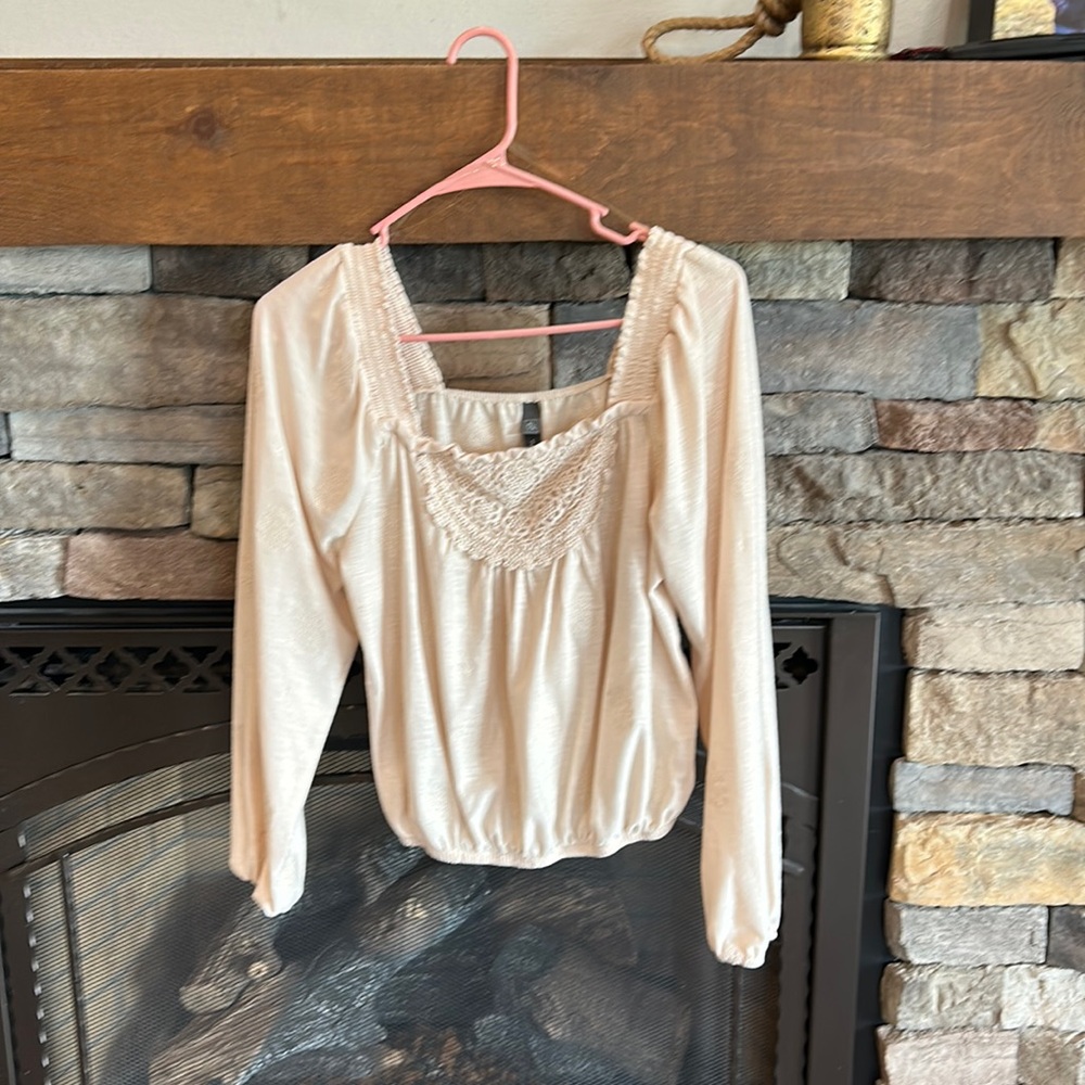 CoCo and Jaimeson billowy shirt with floral embroidery details.
